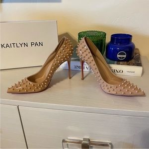 Red / pinkish bottom spiked heels